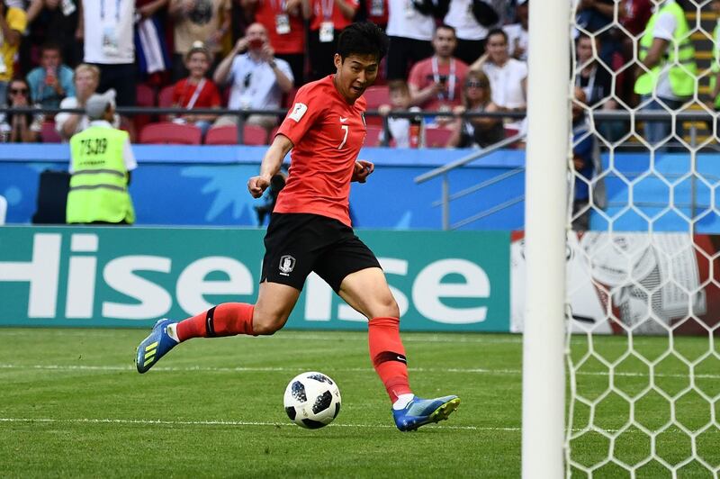 (FILES) In this file photo taken on June 27, 2018, South Korea's forward Son Heung-min scores during the Russia 2018 World Cup Group F football match between South Korea and Germany at the Kazan Arena in Kazan. - Son Heung-min has lit up the World Cup and the Premier League but unnervingly it is the Asian Games in Indonesia, which starts on August 18, 2018, that could make or break the career of the prolific South Korean forward. Anything less than gold and Son, 26, faces a compulsory stint of nearly two years' military service -- a severe blow to the player, his national team and his club, Tottenham Hotspur. (Photo by Jewel SAMAD / AFP) / RESTRICTED TO EDITORIAL USE - NO MOBILE PUSH ALERTS/DOWNLOADS