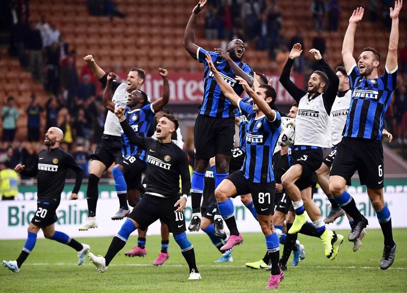 Inter Milan players celebrate at the final whistle. AFP