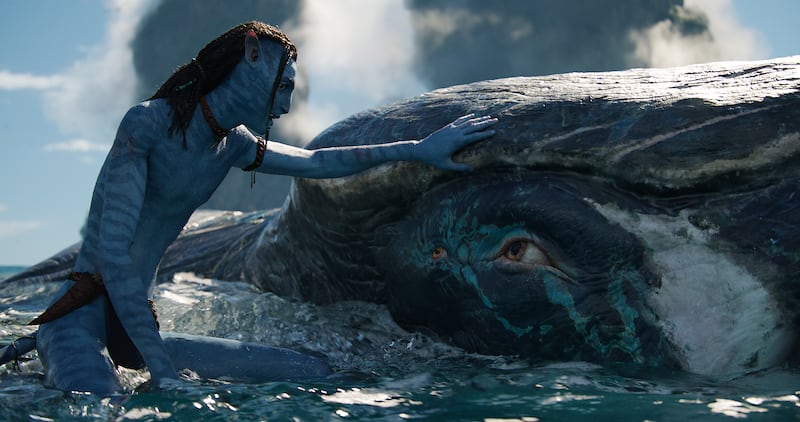 Britain Dalton as Lo’ak, with Tulkun, a large whale-like creature native to the oceans of Pandora