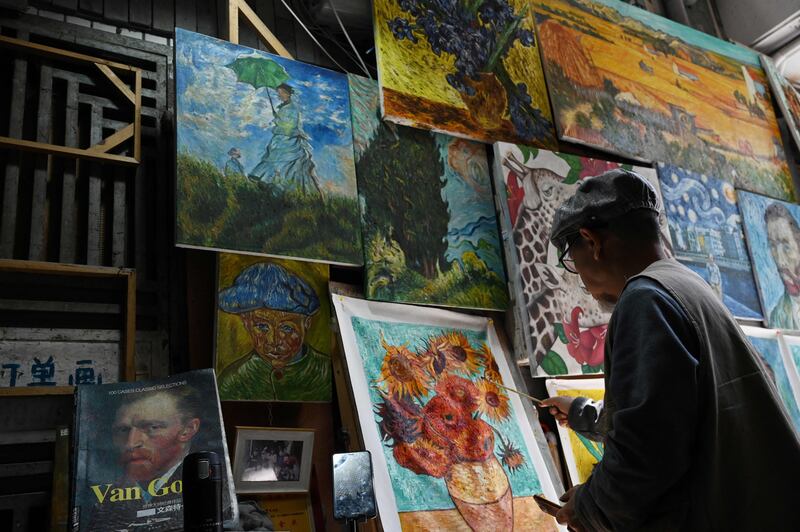 Artist Deng Fei paints a replica of Vincent van Gogh's Sunflowers
