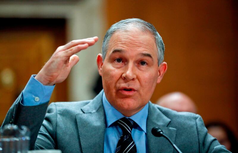 FILE - In this Jan. 30, 2018, file photo, Environmental Protection Agency administrator Scott Pruitt testifies before the Senate Environment Committee on Capitol Hill in Washington. Environmental regulators announced on Monday, April 2, 2018, they will ease emissions standards for cars and trucks, saying that a timeline put in place by President Obama was not appropriate and set standards â€œtoo high.â€ Pruitt says the agency will work with all states, including California, to finalize new standards. (AP Photo/Pablo Martinez Monsivais, File)
