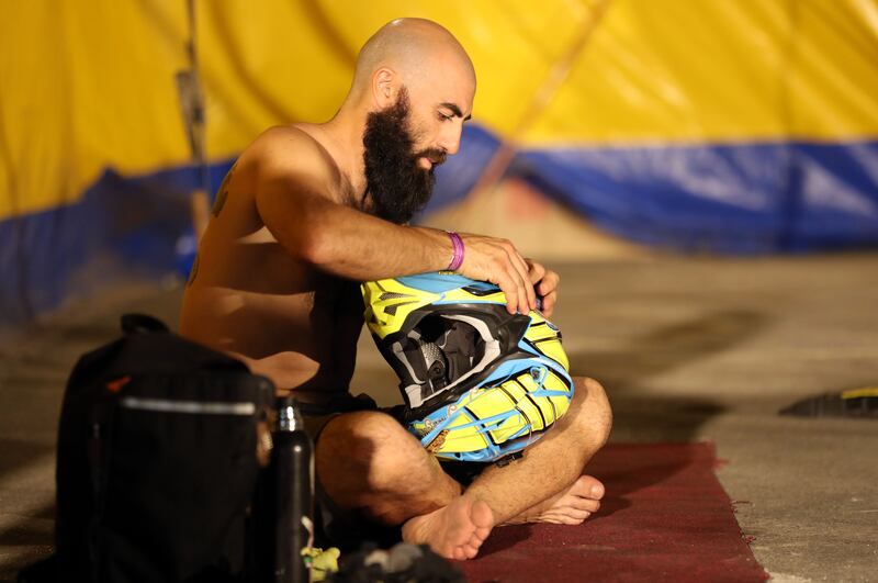 A performer checks his equipment before the show.