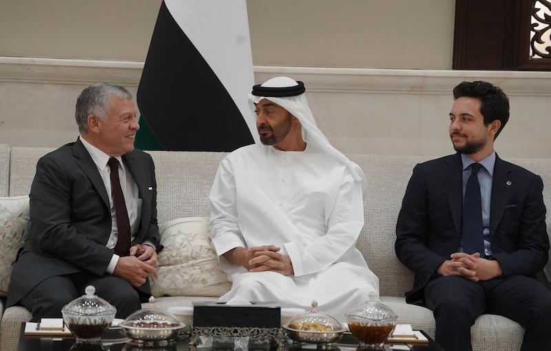 A handout picture released by the Jordanian Royal Palace on May 22, 2019 shows Jordanian King Abdullah II (L) and his son Crown Prince Hussein (R) meeting with the UAE's Sheikh Mohamed bin Zayed Al-Nahyan (C), Crown Prince of Abu Dhabi Deputy Supreme Commander of the Armed Forces, in Abu Dhabi. (Photo by Yousef ALLAN / Jordanian Royal Palace / AFP) / RESTRICTED TO EDITORIAL USE - MANDATORY CREDIT "AFP PHOTO / JORDANIAN ROYAL PALACE / YOUSEF ALLAN" - NO MARKETING NO ADVERTISING CAMPAIGNS - DISTRIBUTED AS A SERVICE TO CLIENTS