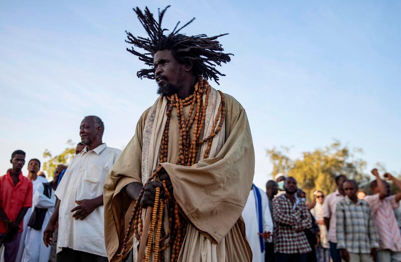A Sudanese Sufi Muslim performs a dance at a gathering outside the Hamad al-Nile shrine in Omdurman, the capital Khartoum's twin city. AFP