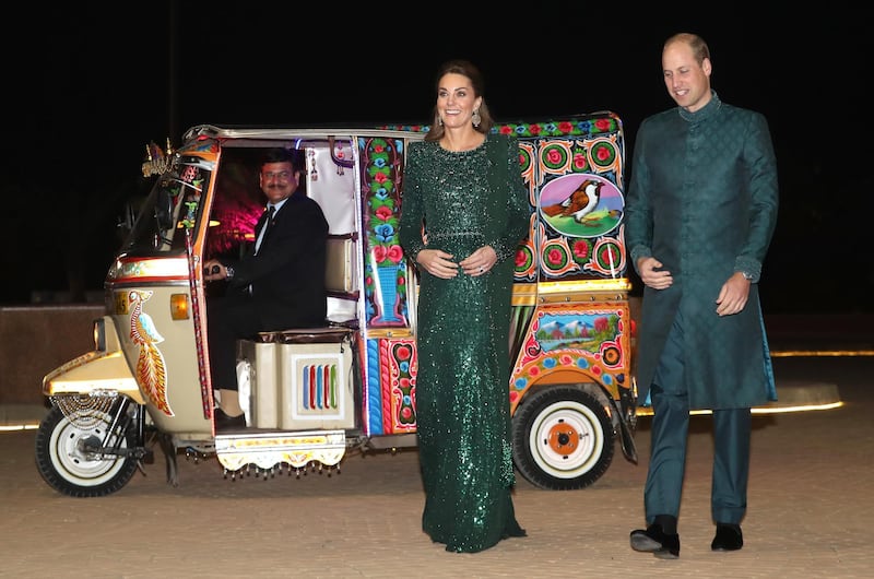 epa07922807 Britain's Catherine, Duchess of Cambridge (C) arrives by Tuk Tuk with her husband Prince William, Duke of Cambridge (R), to attend a special reception hosted by the British High Commissioner at the Pakistan National Monument in Islamabad, Pakistan, 15 October 2019. The royal couple is on an official five-day visit to Pakistan. It is the first royal visit to the country in 13 years.  EPA/CHRIS JACKSON / POOL