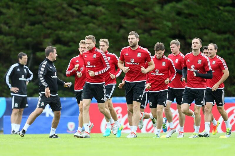 Welsh players warm up during a training session of the Welsh national soccer team, in Dinard, France, Monday, July 4, 2016. Wales will face Portugal in a Euro 2016 semifinal match at the Grand Stade in Decines-Charpieu, near Lyon, France, Wednesday, July 6, 2016.(AP Photo/Vincent Michel)