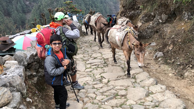 Oscar Pacheco and his fellow trekkers encounter other mountain travellers at Lukla (2,850 metres up), on their way to the Nepalese village of Phakding. 