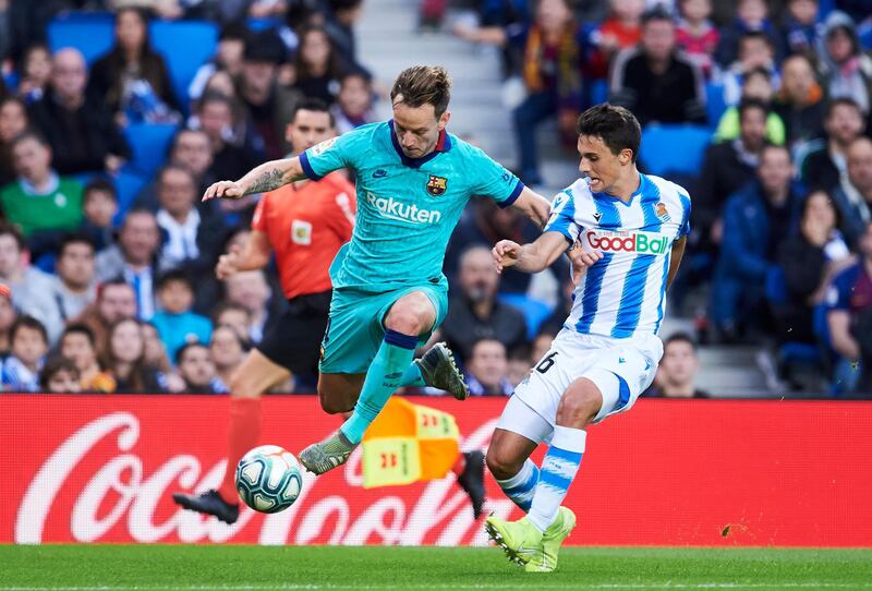 Ivan Rakitic fights for the ball with Ander Guevara of Real Sociedad. Getty Images