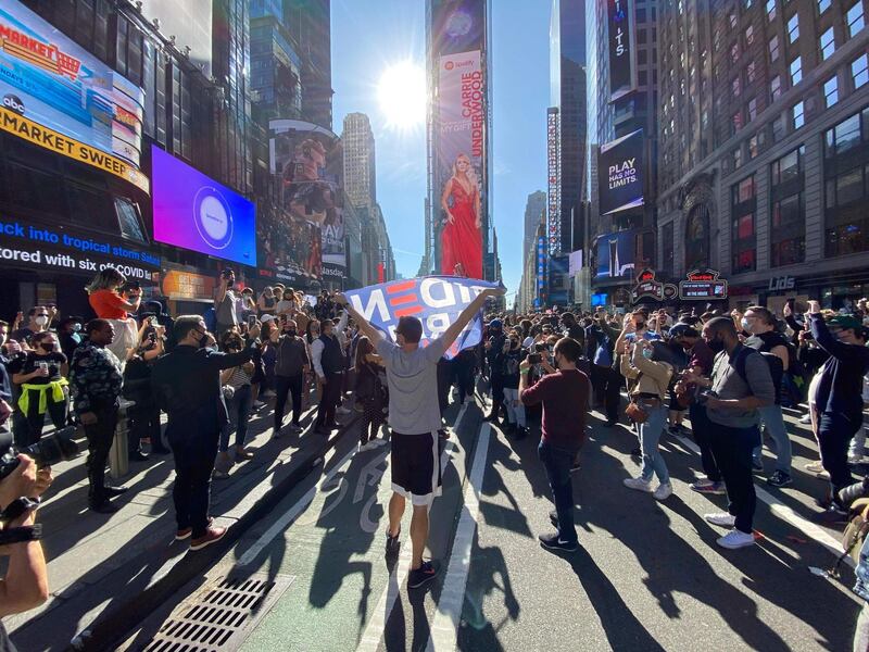 People celebrate at Times Square in New York.  AFP