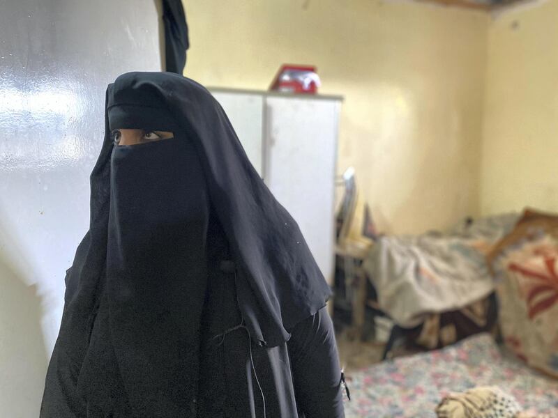 Wafa Al Bureisi, mother of three, stands in her bedroom which has been destroyed by winter rains. Amy McConaghy / The National