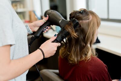 Using a heat-protection product before drying, straightening or curling the hair is non-negotiable. Photo: Adam Winger / Unsplash 