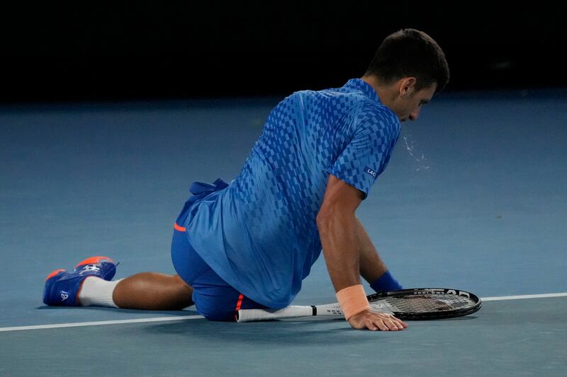 Novak Djokovic takes a tumble in their third round match. AP