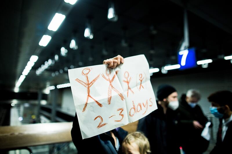 A woman offers accommodation for people fleeing Ukraine at the main railway station in Berlin, Germany. Getty Images