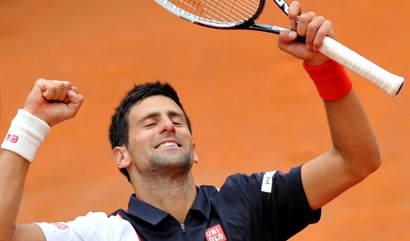 Novak Djokovic of Serbia celebrates after defeating David Ferrer of Spain at the Rome Masters on May 16, 2014, at the Foro Italico. TIZIANA FABI / AFP

