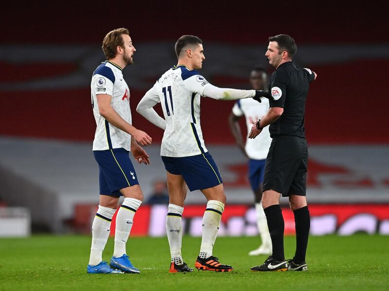 Referee Michael Oliver shows a second yellow and a red card to Tottenham Hotspur's Erik Lamela. PA