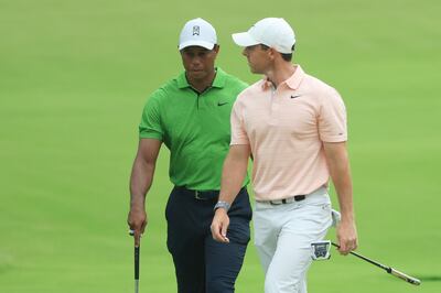 Tiger Woods and Rory McIlroy during the second round at Southern Hills. AFP
