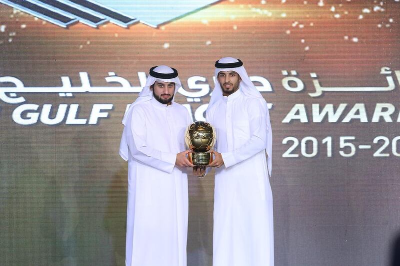 Ali Mabkhout, right, is presented with the Emirati Player of the Year award at the Arabian Gulf League Awards ceremony. Delores Johnson / The National