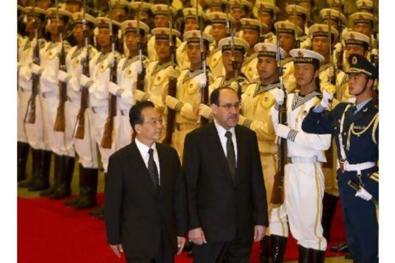Iraqi prime minister Nouri Al Maliki, right and Chinese Premier Wen Jiabao review the Chinese military honour guard during a welcoming ceremony at the Great Hall of the People in Beijing. Andy Wong / Pool/Getty Images