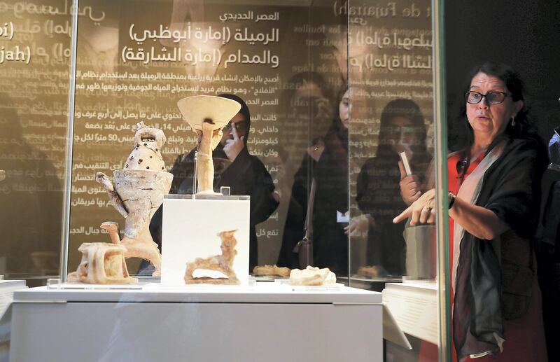 SHARJAH , UNITED ARAB EMIRATES , OCT 18   – 2017 :- Dr. Sophie Mery , Director of the French Archaeological Mission to the UAE ( right ) explaining about the items on display during the exhibition of 40 Years of Archaeological Cooperation Between The United Arab Emirates and France held at Sharjah Archaeology Museum in Sharjah. (Pawan Singh / The National) Story by John Dennehy