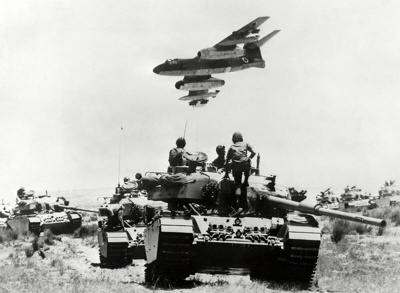 A mirage "Vautour" flying over Israeli soldiers sitting o tanks in the the Sinai peninsula on the Israel-Egypt border during the six days in 1967. AFP
