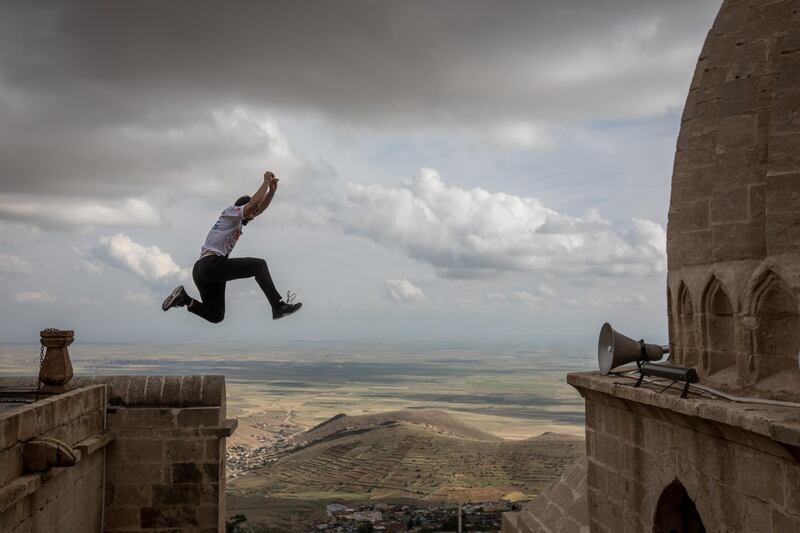 Competitors warm up ahead of the start of the freestyle category during the second round of the World Parkour Championships in Mardin, Turkey.  Chris McGrath / Getty Images