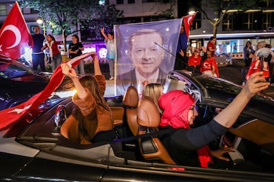 Erdogan supporters celebrate on Berlin's Kurfuerstendamm shopping street. Getty 