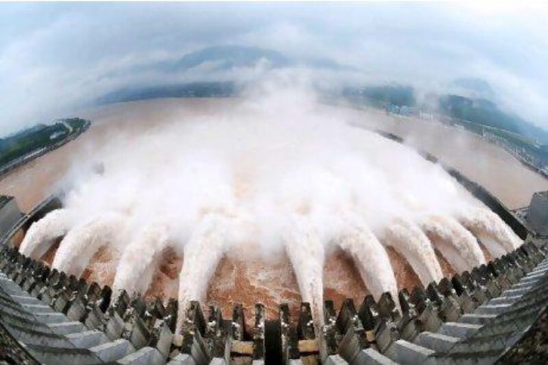 A picture shows this year's biggest release of water from the sluice for flood prevention at the Three Gorges Dam in Yichang, central China's Hubei province, on July 20, after relentless torrential rains hit Yangtze River areas. The massive water flow on the Yangtze was expected to pose the biggest test for the Three Gorges Dam -- the world's largest hydroelectric project -- since it was completed in 2006, as rivers throughout rain-hit regions have risen to or beyond their warning levels, flooding numerous towns and cities.