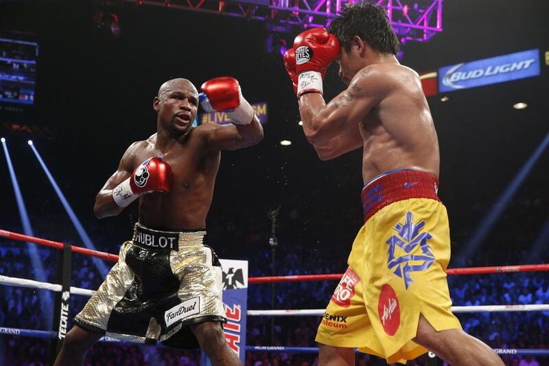 Floyd Mayweather, left, in action during his dominant points victory over Manny Pacquiao. AFP