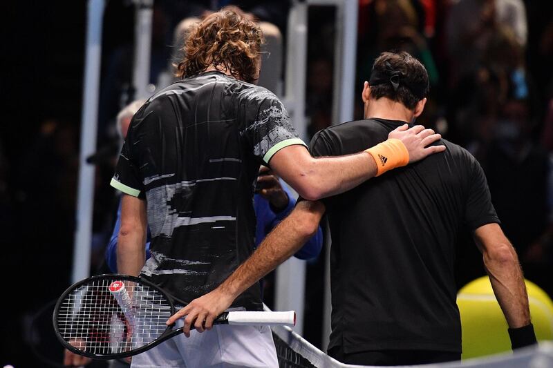 Stefanos Tsitsipas, left, and  Roger Federeafter the match. AFP