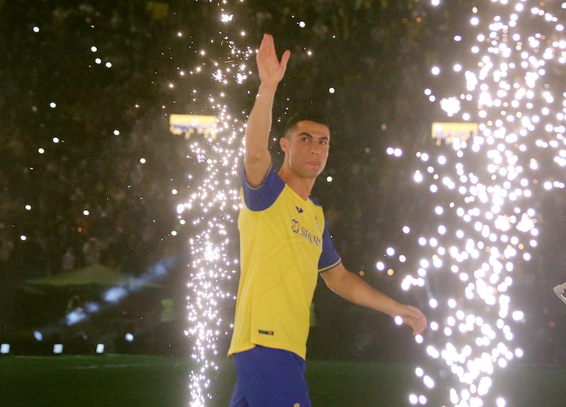 New Al Nassr signing Cristiano Ronaldo waves to the fans at  Mrsool Park during his unveiling. Reuters
