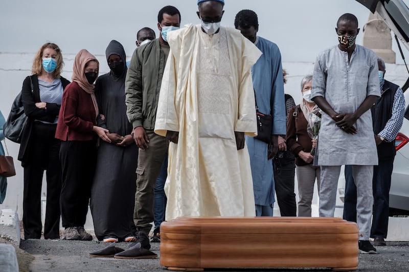 Ivorian migrant Cadi, third left, mother of Yamila, a 5-year-old girl who died in 2021 following a rescue operation of a small boat adrift in the Atlantic Ocean, mourns during her daughter’s burial in Las Palmas de Gran Canaria.  EPA