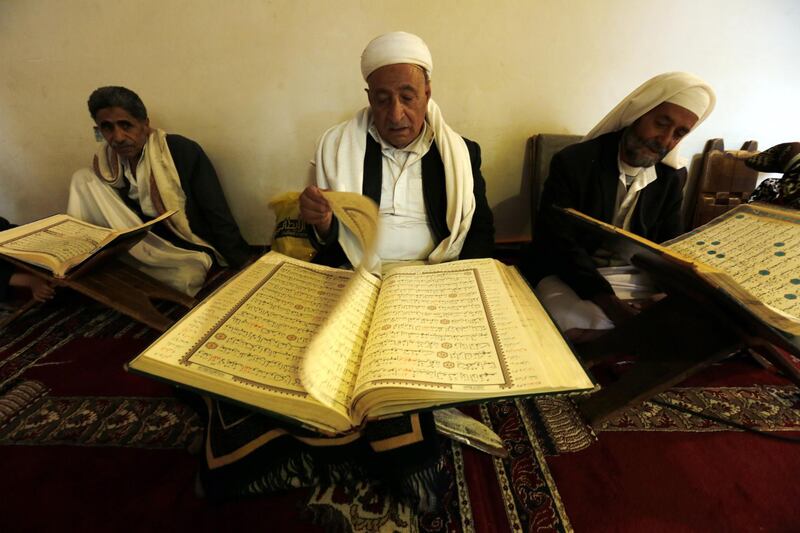 Yemenis read the Quran at a mosque in Sanaa. EPA