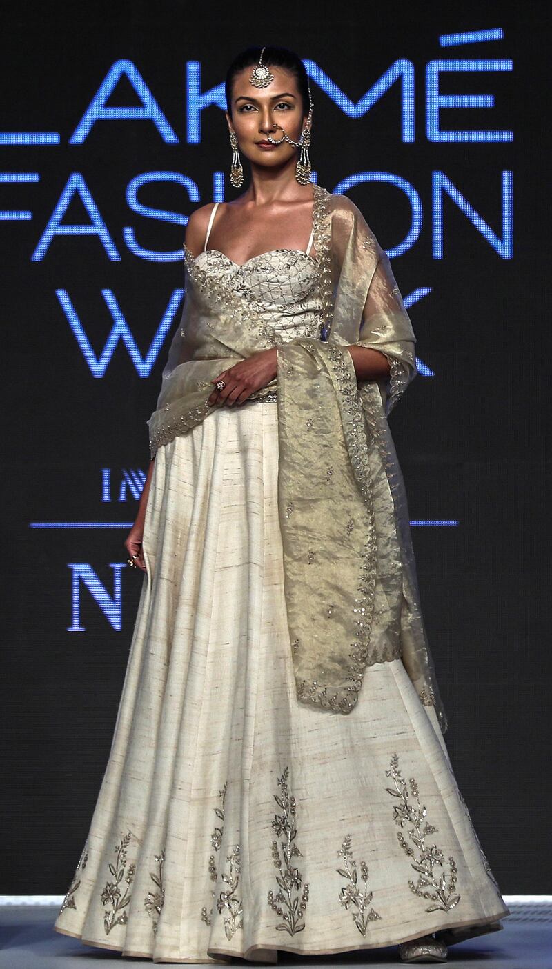 Designer Anita Dongre employs a cream and metallic palette in her creations for spring/summer 2019 at Lakme Fashion Week. EPA