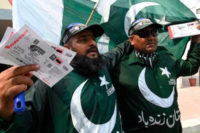 Pakistani cricket fans display tickets for the upcoming cricket match between Pakistan and Sri Lanka in Lahore on September 21, 2019. Pakistan on September 21 left out veteran batsman Mohammad Hafeez for next week's series start against Sri Lanka, who are touring the country for the first time since they were targeted in a terror attack. / AFP / ARIF ALI
