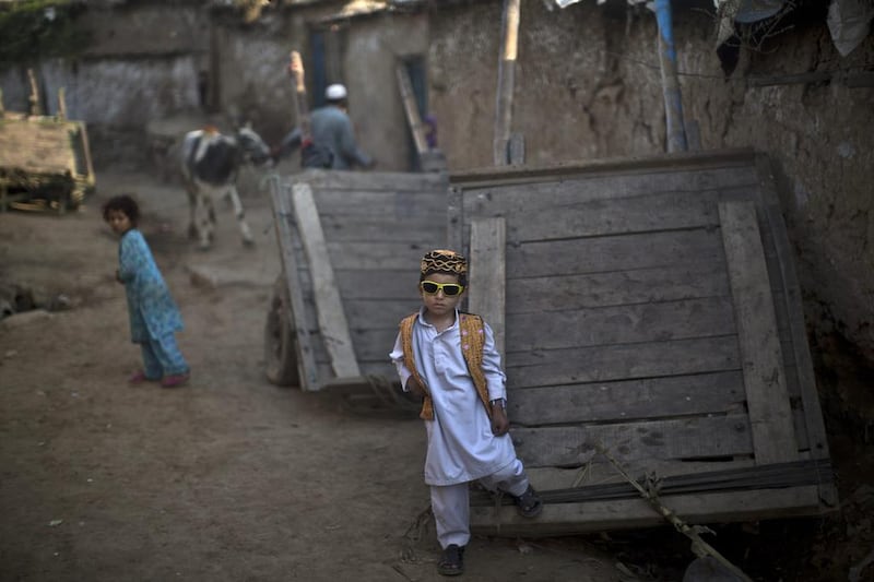 Pakistani boy, Afnan Rahim, 5, celebrates the first day of the Muslim holiday of Eid Al Adha. Muhammed Muheisen / AP Photo