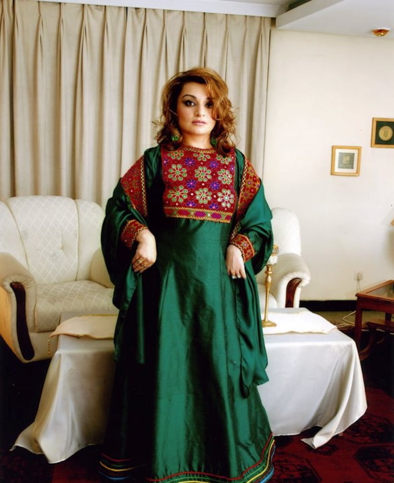A woman poses in traditional Afghan attire, in Kabul, Afghanistan, 2005, in this picture obtained from social media.  Dr.  Bahar Jalali/via Reuters