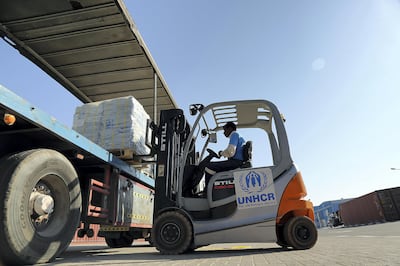 Dubai, 25,September,2017 : Workers loading the Humanitarian Aid from the UNHCR  warehouses to Bangladesh in support of Rohingya refugees from UNHCR office in Dubai. Satish Kumar / For the National / Story by Nick Webster