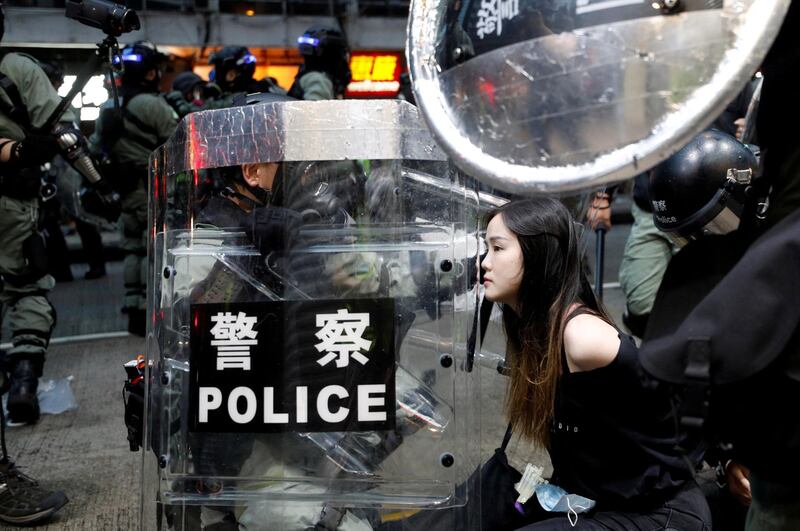 Riot police detain a protester during an anti-government rally in central Hong Kong. Reuters