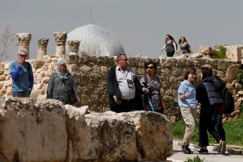 Tourists walk during their visit to the Amman Citadel, an ancient Roman landmark, in Amman, Jordan, March 10, 2020. REUTERS/Muhammad Hamed