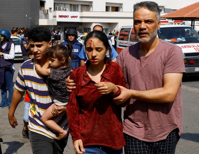 A Palestinian girl injured in Israeli strikes is taken to hospital in Gaza City. Reuters