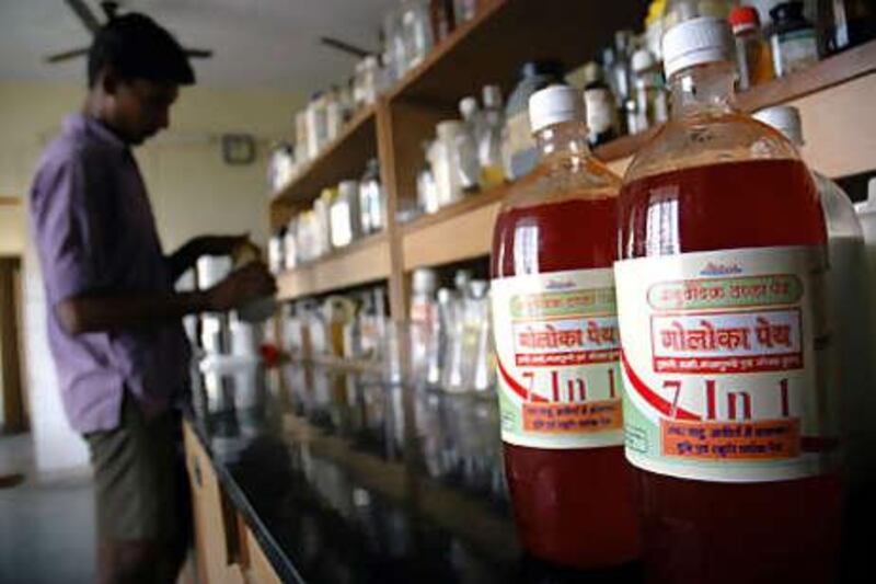 Bottles of Gauloka Peya, a drink containing traces of cow urine, line shelves at the Kanpur office of the Hindu group Gau Seva Sangh.