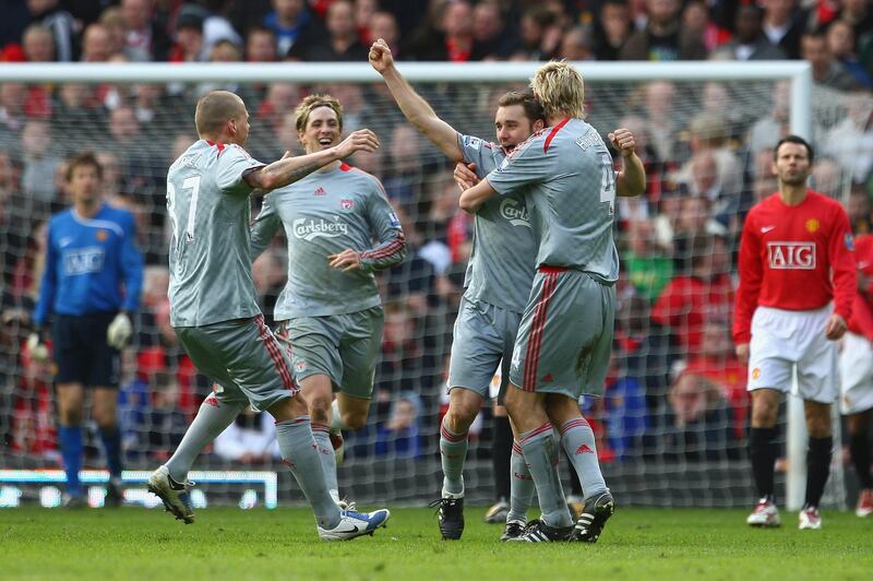 MANCHESTER, UNITED KINGDOM - MARCH 14:  Fabio Aurelio of Liverpool celebrates scoring his team's third goal with his team mates during the Barclays Premier League match between Manchester United and Liverpool at Old Trafford on March 14, 2009 in Manchester, England.  (Photo by Laurence Griffiths/Getty Images)