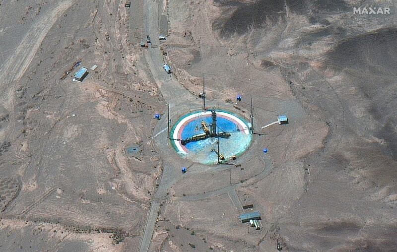 A satellite image shows a rocket about to be attached to a launch tower at Imam Khomeini Space Centre near Semnan, Iran, on Tuesday.  Maxar Technologies via AP