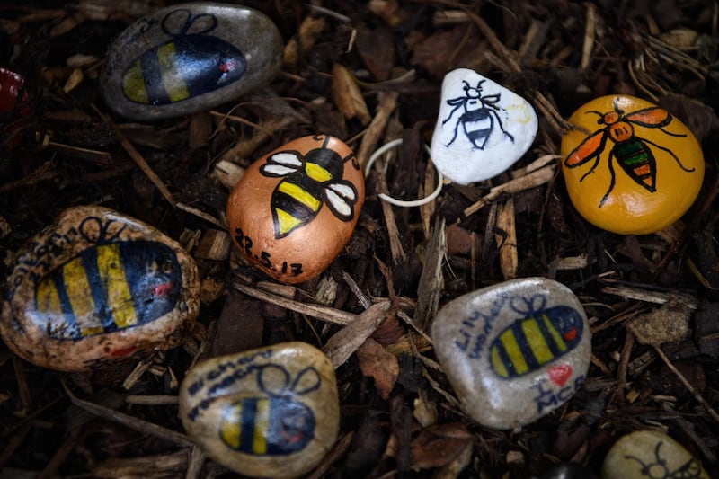 Decorated stones, featuring the Manchester bee icon are seen on the morning of the first anniversary of the terrorist attack in central Manchester. Getty