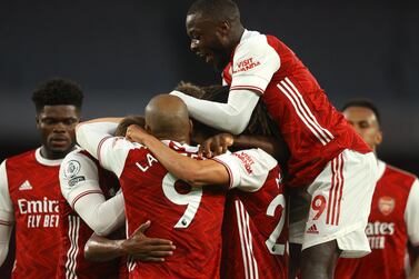 Arsenal players celebrate after Arsenal's Willian scored his side's third goal during the English Premier League soccer match between Arsenal and West Bromwich Albion at the Emirates Stadium in London, England. AP