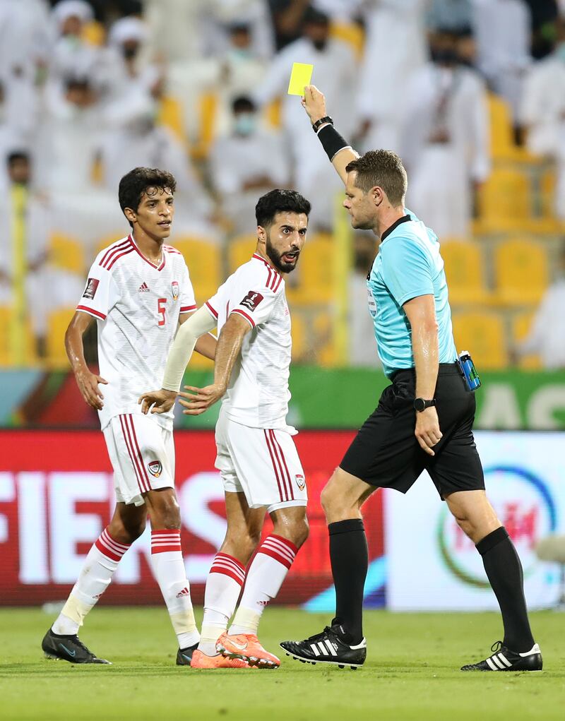 Bandar Al Ahbabi of the UAE is shown a yellow card. Chris Whiteoak / The National