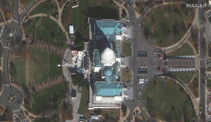 This handout satellite image released by Maxar Technologies shows the US Capitol it's surrounding area with a view of the inauguration stands/seats along the west side of the Capitol ahead of President-elect Joe Biden's inauguration, in Washington, DC.  AFP PHOTO