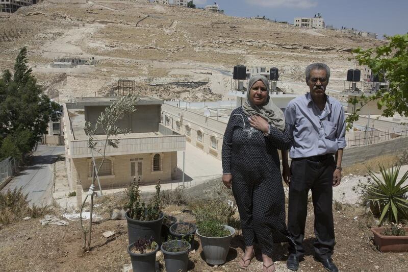Mahmoud Al Mahdi, 73, and his wife Oafish Al Maghreb, 56, outside their home on a rocky hillside in Abu Dis, a Jerusalem suburb separated from the holy city by Israel’s concrete security barrier. Mr Al Mahdi was at university in Iraq on June 10, 1967 - the day that Israel destroyed the neighbourhood where he grew up in. Heidi Levine for The National