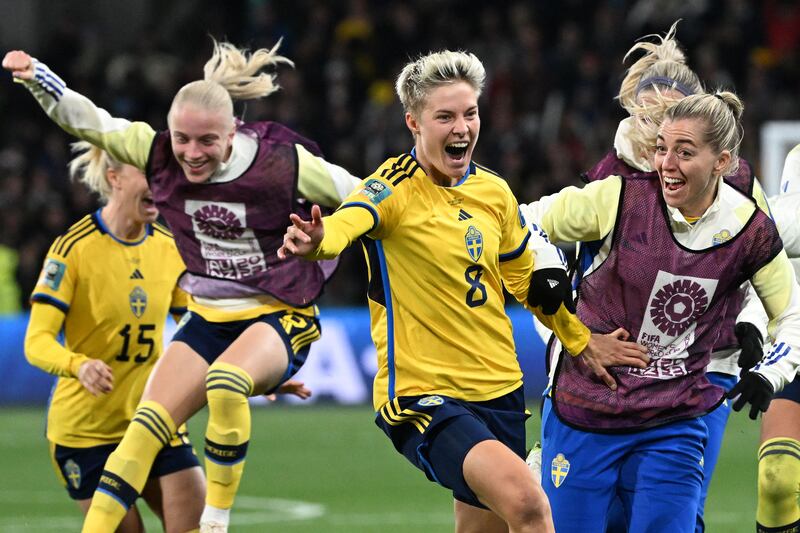Sweden forward Lina Hurtig, centre, and teammates celebrate after their penalty shoot-out win against the USA in Melbourne on August 6, 2023. AFP