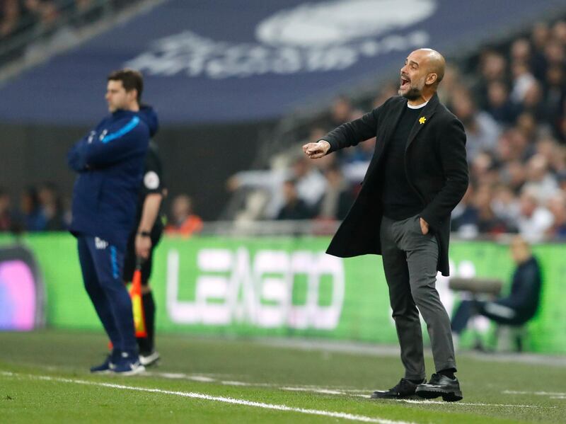 Tottenham manager Mauricio Pochettino, left, and Manchester City manager Pep Guardiola watch on from the touchline. Frank Augstein / AP Photo